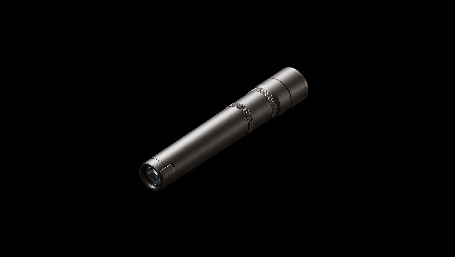 Field 01 floating in the dark at a three-quarter angle, brushed titanium, two knurled bands.